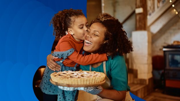 Family celebrating holiday season with pie.
