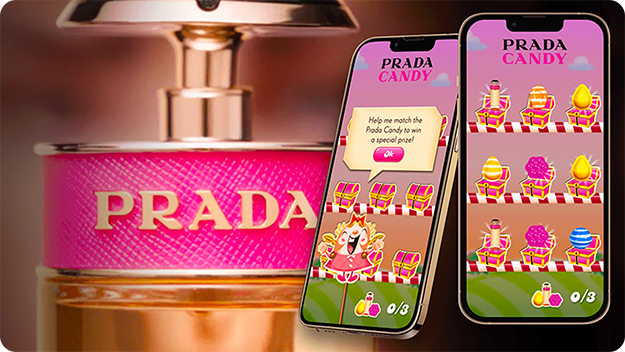 Nahaufnahme eines pinkfarbenen Prada-Parfümflakons links und zwei Smartphones rechts mit einem Prada-Candy-Matching-Spiel und einer Gewinnmeldung.